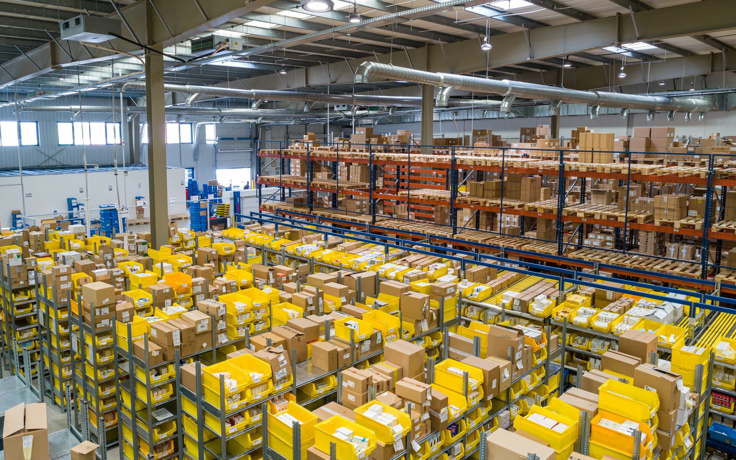 Stacked cartons of packaged groceries on a distribution warehouse floor