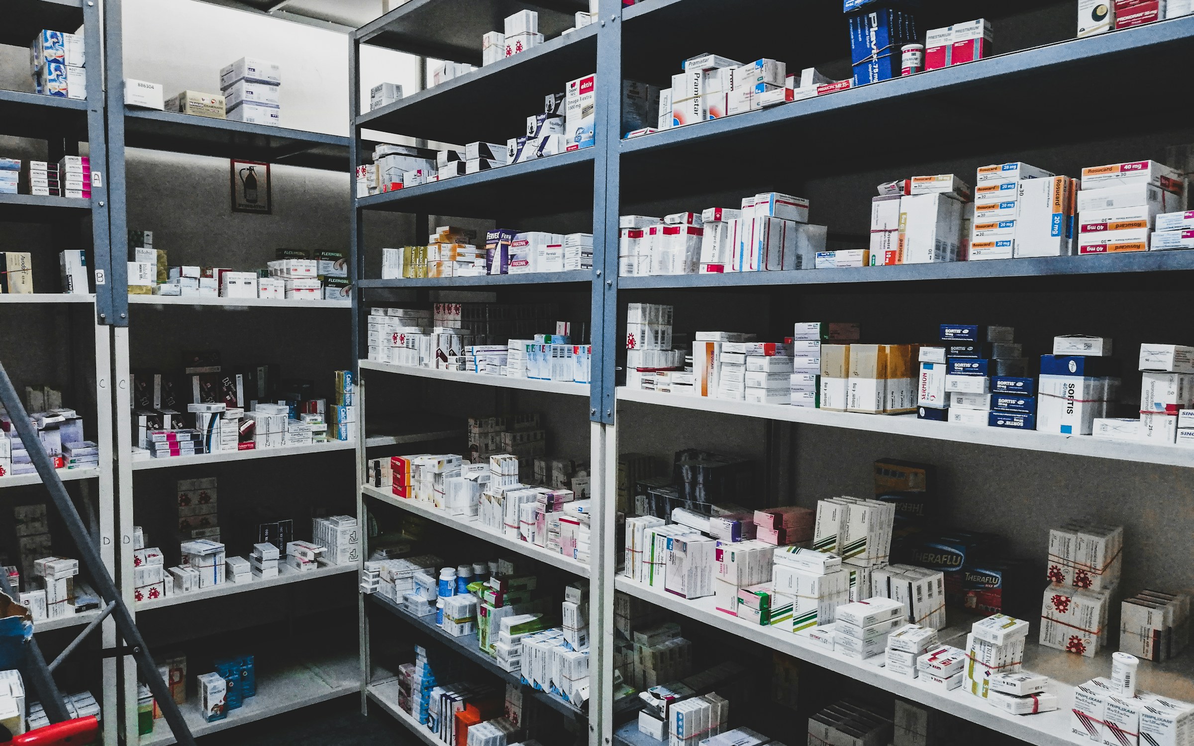 Shelves of boxed medicines in a pharmaceutical wholesale store room